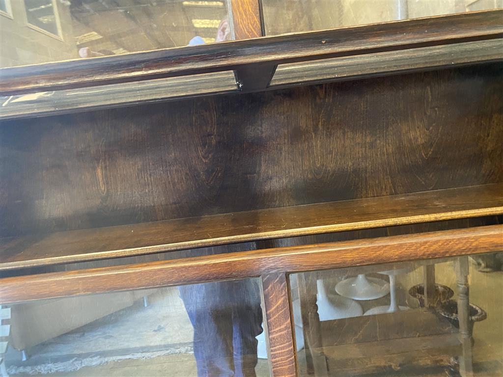 An early 20th century Gunn oak six section bookcase, length 126cm, depth 29cm, height 208cm